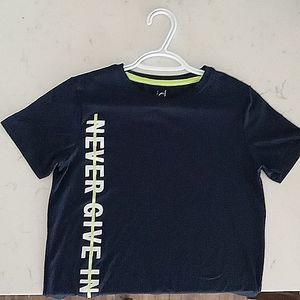 Dark blue medium ideology brand text: NEVER GIVE IN.